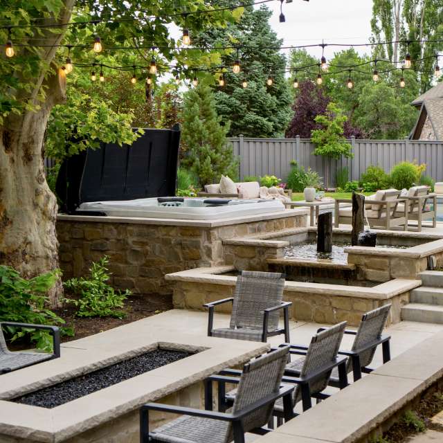 An abstract painting depicts strong intersecting paint brush lines of dark grays against a white background.